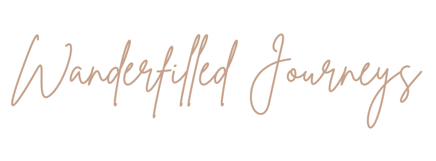 "Wanderfilled Journeys" written in a light brown, elegant cursive script on a white background.