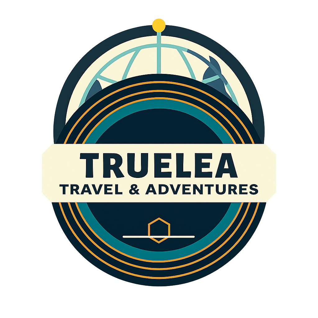 Logo for Truelea Travel & Adventures: compass icon above cursive text, navy and orange colors.